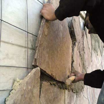 Rifinitura facciata della casa di pietra cemento cellulare. Foto dal servizio immagini Yandex